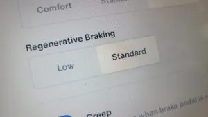 Tesla regenerative braking settings screen explaining why mechanical brake service is still needed