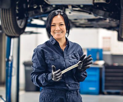 female staff performing Tesla Brake Repair Service